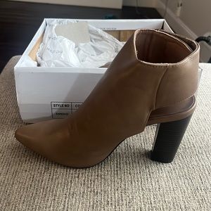 Never worn! Taupe closed toe, strap heels. Can be dressed up or down.